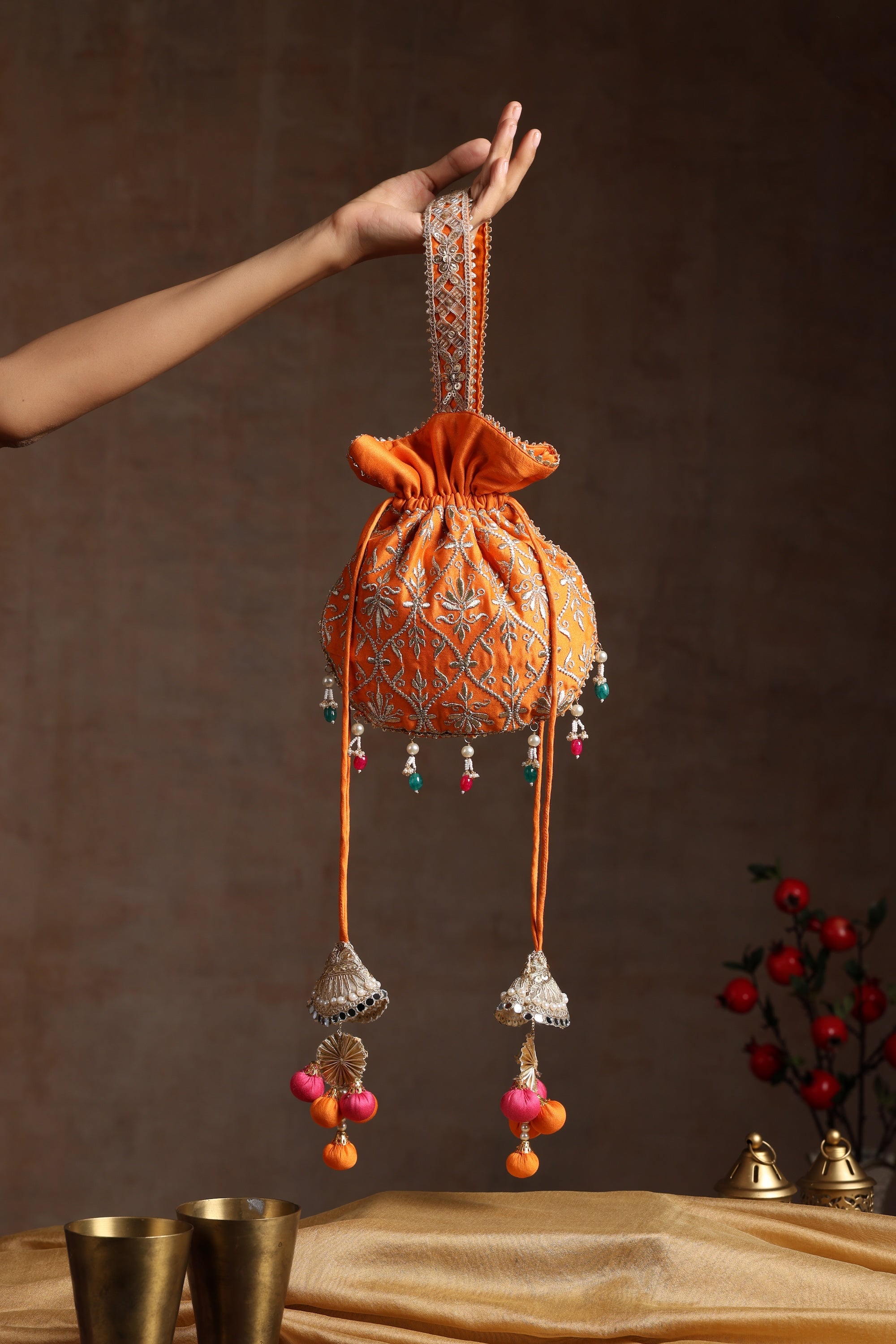 Sui Kala Dwar Orange Embroidered Potli Bag