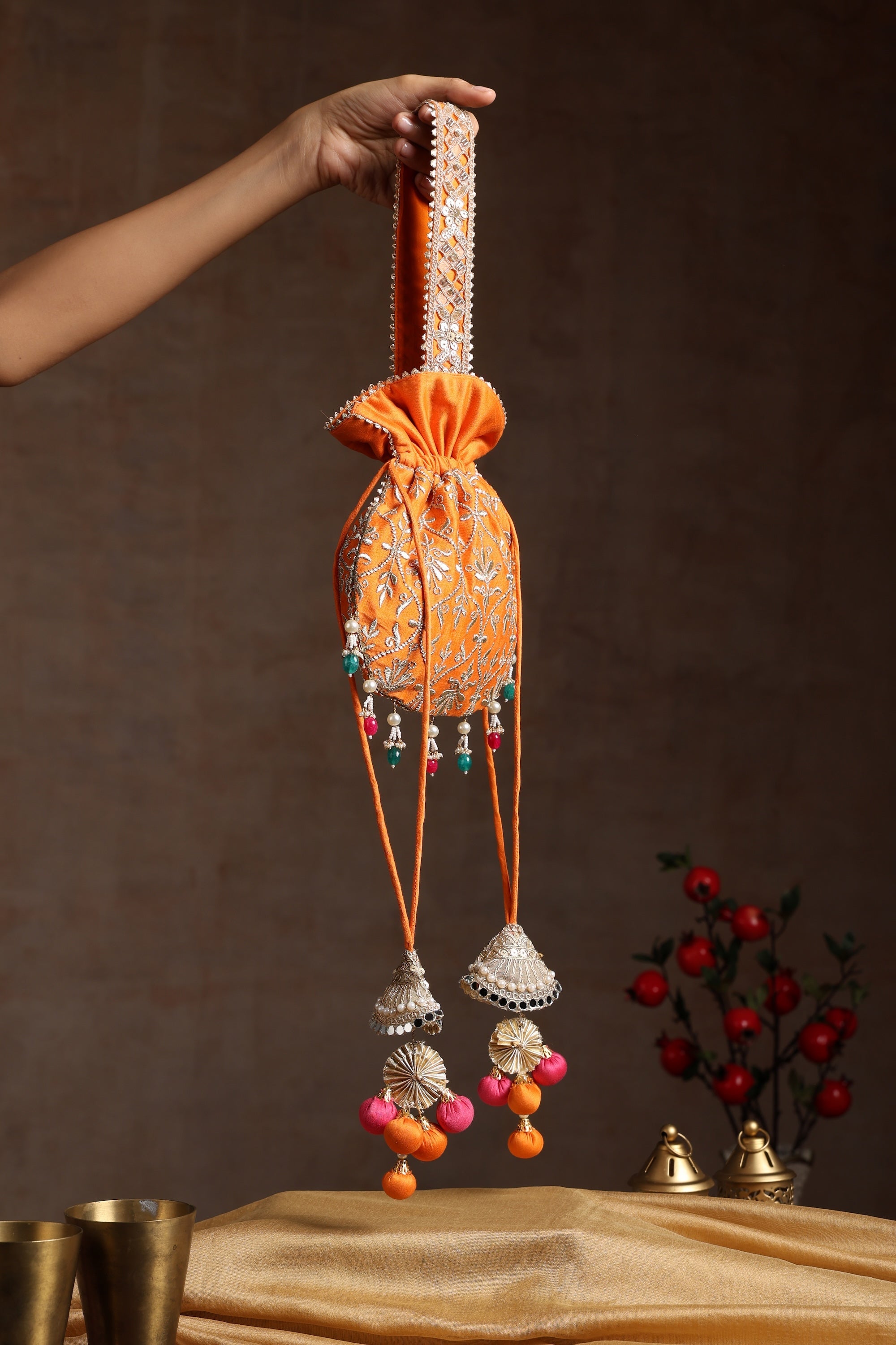 Sui Kala Dwar Orange Embroidered Potli Bag