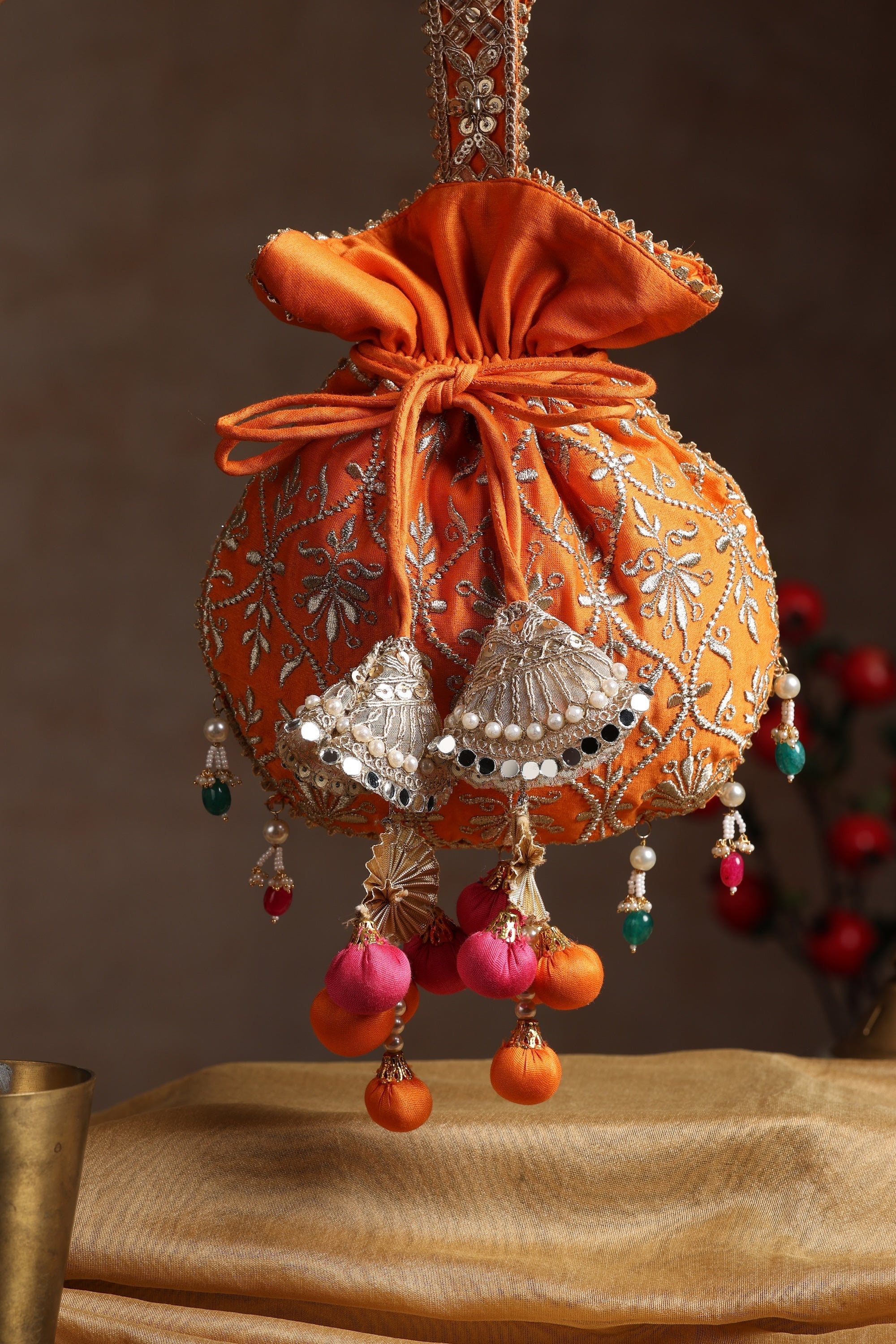 Sui Kala Dwar Orange Embroidered Potli Bag